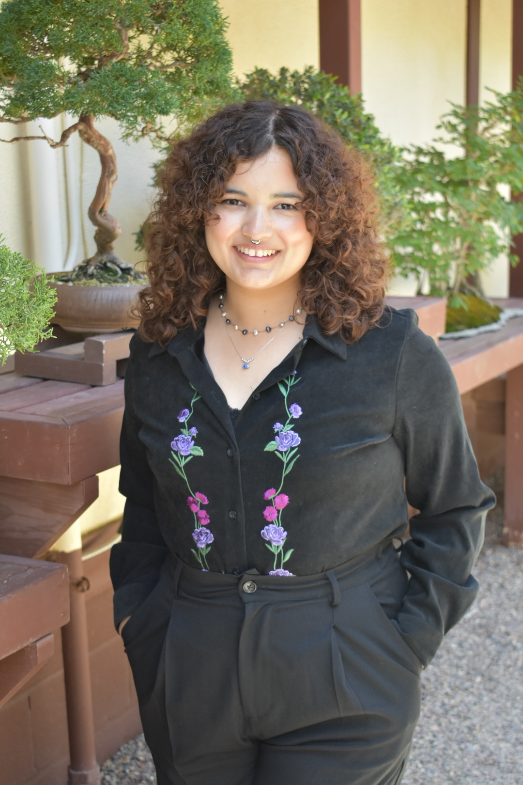 Darlene Meza, MA, AMFT, APCC — compassionate telehealth therapist providing affirming support for individuals and couples. This photo captures Darlene’s approachable and warm presence, reflecting their commitment to creating a safe, welcoming space for clients.