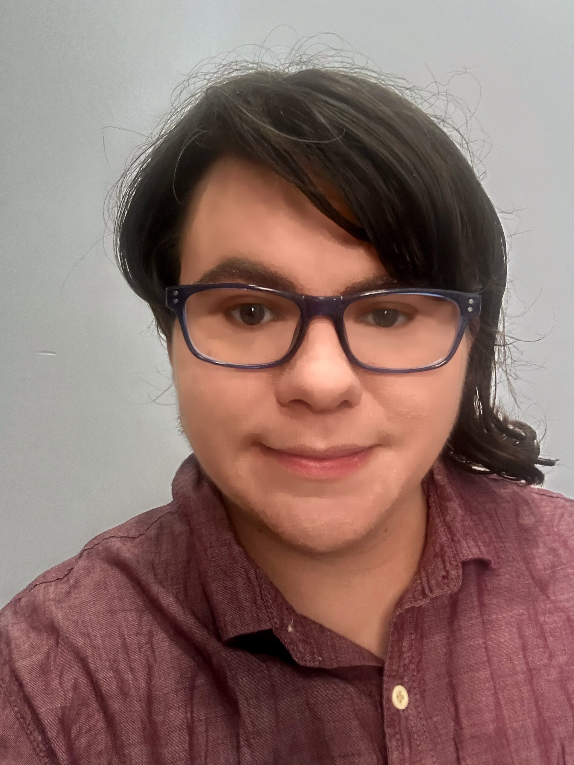 Picture of Kae Peterman, LMSW. They are a white, brunette nonbinary person with an asymmetrical haircut and glasses in a red button-up shirt. Picture of Kae Peterman, LMSW. They are a white, brunette nonbinary person with an asymmetrical haircut and glasses in a red button-up shirt.